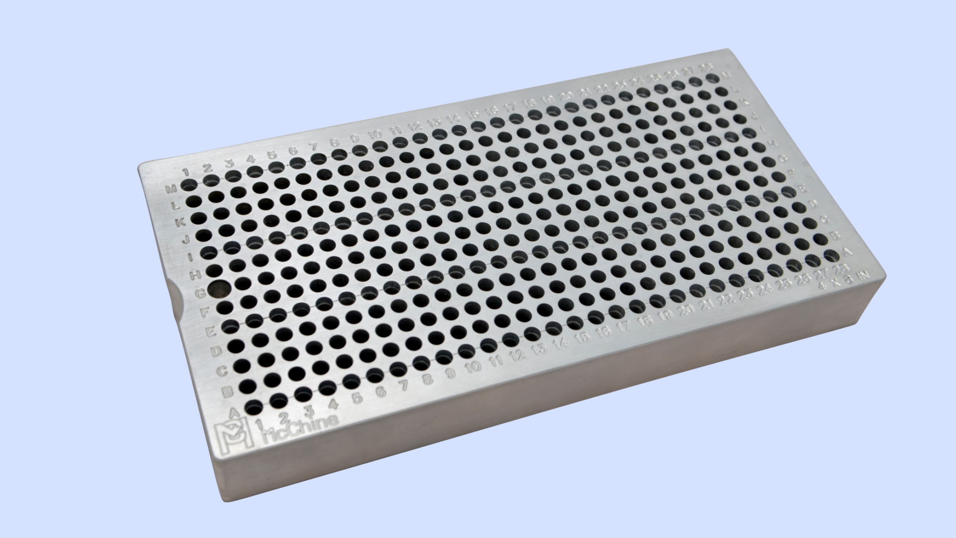 A top view of the McChine 4x8 Back Bolt Fixture Plate, detailing its precision 364-hole grid and the four counterbored rows for part locating.
